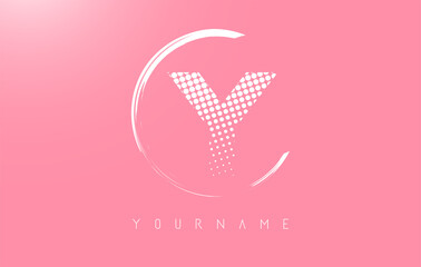 White Y letter logo design with white dots and white circle frame on pink background.