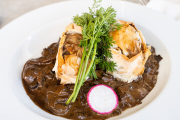 Breaded beef steak plate with mushroom sauce and parsley leaves. Gourmet restaurant concept