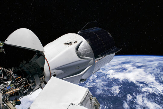 The SpaceX Crew Dragon spacecraft is docked to the International Space Station. Elements of this image furnished by NASA - Powered by Adobe