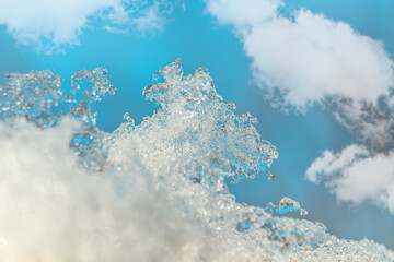 Dirty melting snow in nature in spring close-up.