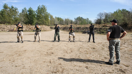 Military army soldiers in action tactical combat shooting from rifle machine gun. Shooting and...