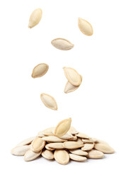 Pumpkin seeds not peeled fall on a heap on a white background. Isolated