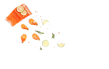 Flat lay Shrimps, frozen with salmon steak with herbs and lemon on a white background