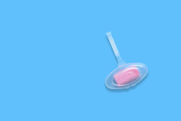 Inexpensive toilet air refresher on white blue background
