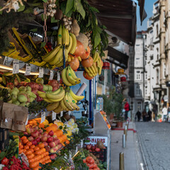 Various fruits and vegetables: bananas, apples, pomelo, oranges, tangerines, tomatoes, garlic,...