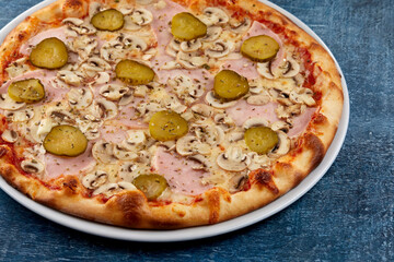 fresh pizza on the white plate