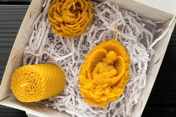 Decorative Easter candles in the box, made of beeswax with a honey aroma for interior and tradition.