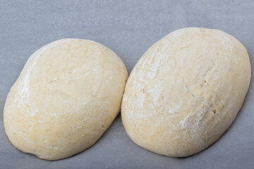 Fototapeta na wymiar Sourdough dough lying on baking paper, whole wheat recipe.