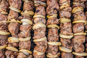 Grilled pork kebab meat on metal skewers