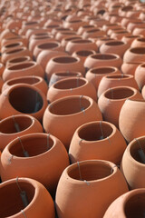 Fototapeta na wymiar Rows of ceramic clay pots, selective focus