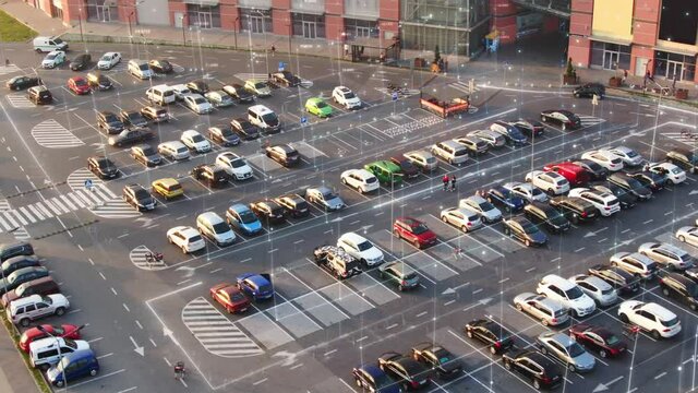 Aerial top drone view of parking lot of the shopping mall, supermarket with cars. Digital Animation showing free places. Augmented reality technology. Transport. Urban City. 4k