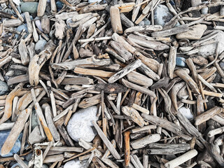 Driftwood on beach, Abstract background texture of driftwood Natural backdrop of wood on shore.