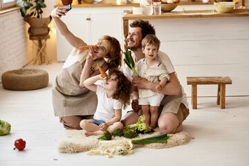 happy family with their children cooking in the kitchen