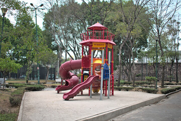 Fototapeta na wymiar Playground for children in a southwestern side park