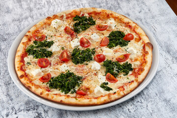 fresh pizza on the white plate