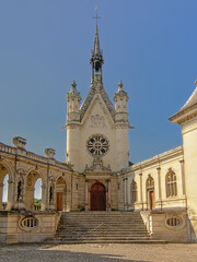 Chapel of the castle of chantilly, on a sunny day with clear blue sky, view from the inner court
