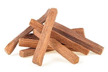 Small heap of sandalwood sticks isolated on a white background. Chandan or sandalwood.
