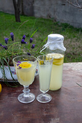 homemade lemonade in a bottle and glasses