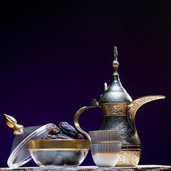 Eid and Ramadan set with Arabian coffee and dates set in dark background. Festive greeting card, an...