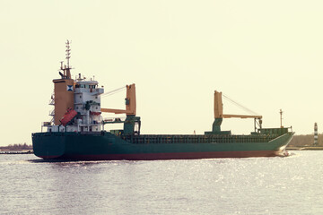 The cargo ship is approaching shore