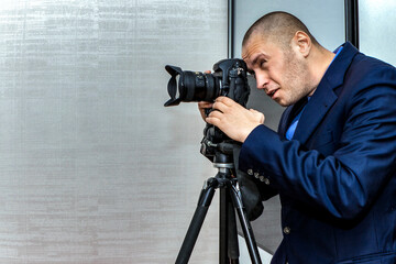 The photographer takes pictures from a tripod at a wide angle in the interior