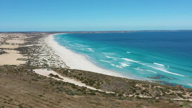 2020 - Excellent aerial shot of blue waves lapping the white shoreline of Daly Head on Yorke Peninsula, Australia.