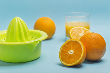 Making orange juice with a manual juicer