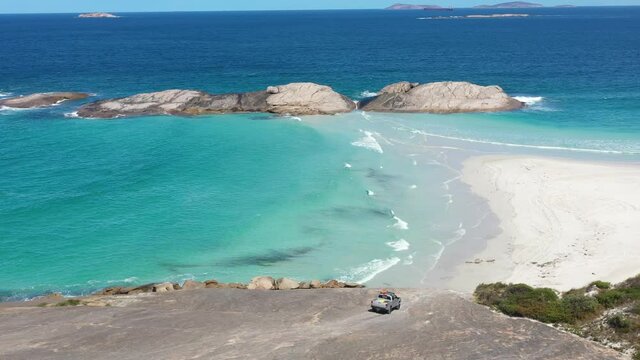 2020 - Excellent aerial shot of a truck driving towards the beach on Wylie Bay, Esperance, Australia.