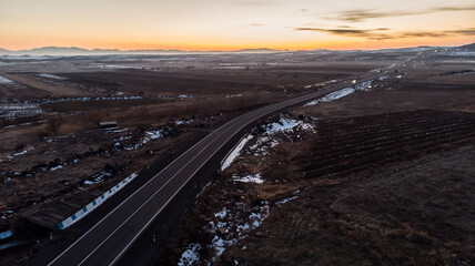 Fototapeta premium road in landscape at the sunset