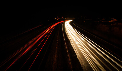 Fototapeta na wymiar Long exposure shot of road during night. Light painting 