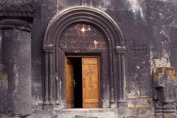Fototapeta na wymiar A wooden door in a church