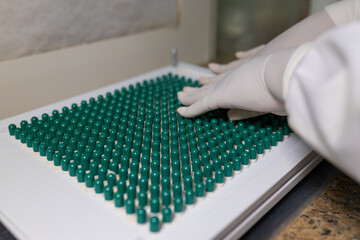making green capsules. compounding pharmacy. compounding green medication.