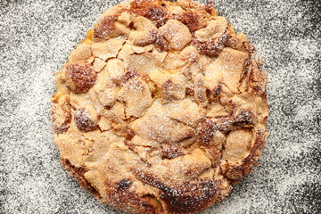 Top view of apple pie with powdered sugar