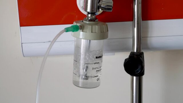Ankara, Turkey - March 2021: Medical oxygen flow meter working near patient bed in hospital. Equipment medical Oxygen tank and Cylinder for care a patient respiratory disease and emergency CPR at Hosp