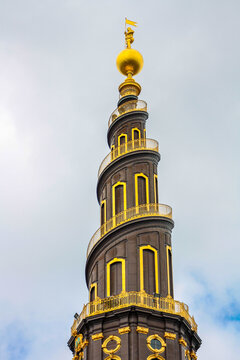 The top of the tower of the Vor Frelsers Kirke, with the characteristic spiral staircase and the golden statue at the top