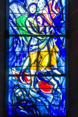 Zurich, Switzerland - April 19. 2021 : Details of the stained glass window of the Protestant church Fraumunster designed by Marc Chagall - obrazy, fototapety, plakaty