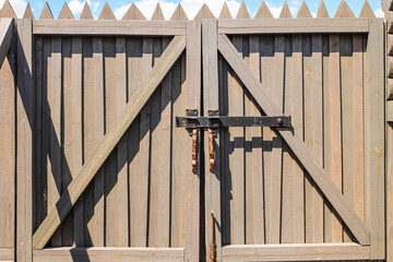 Old wooden gate with overhead bolt
