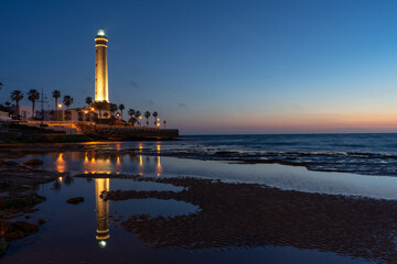 Naklejka premium horizontal view of the Chipiona lighthouse in Andalusia at sunset