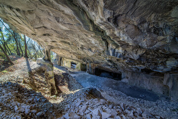 Beautiful Limestone cave, Old Oolitic stone quarries in Massone, The extracted stone, called 