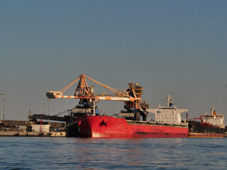 Fototapeta premium industrial port with ship and heavy duty crane brindisi. 