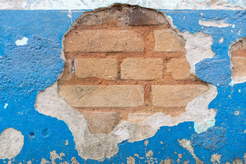 blue wall with exposed brick © Leonidas