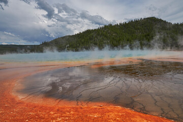 Prismatic pool with colored earth and hot water