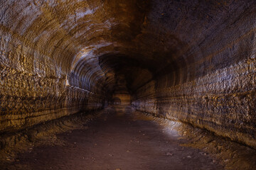 Fototapeta na wymiar Abandoned prospecting adit. Tunnel at limestone at abandoned mine