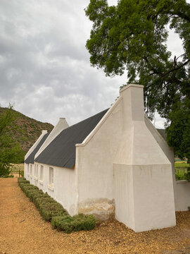 Historical building in cape dutch architecture style at De Kombuys Estate, Cangoo Valley, Oudtshoorn, South Africa