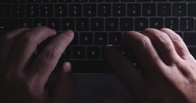 4K Video close up top view hand typing on notebook keyboard. Concept for office working and technology.