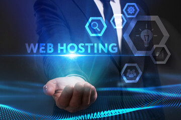 Business, Technology, Internet and network concept. Young businessman working on a virtual screen of the future and sees the inscription: Web hosting