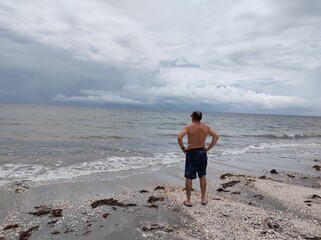 person walking on the beach