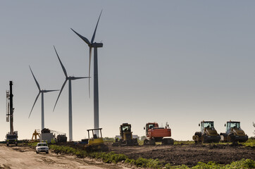 Row of three modern windmills in the countryside near Tarariras, Colonia. © Marquicio