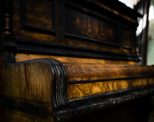 close up of old wood piano
