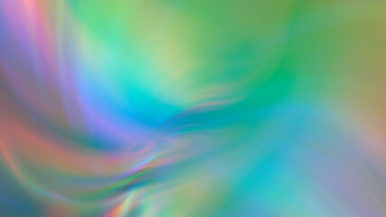 Abstract gradient blurred background with rainbow highlights.